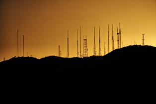 cell network towers during sunset